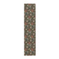 A floral patterned table runner inspired by William Morris, displayed on a dining table.