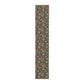 A floral patterned table runner inspired by William Morris, displayed on a dining table.