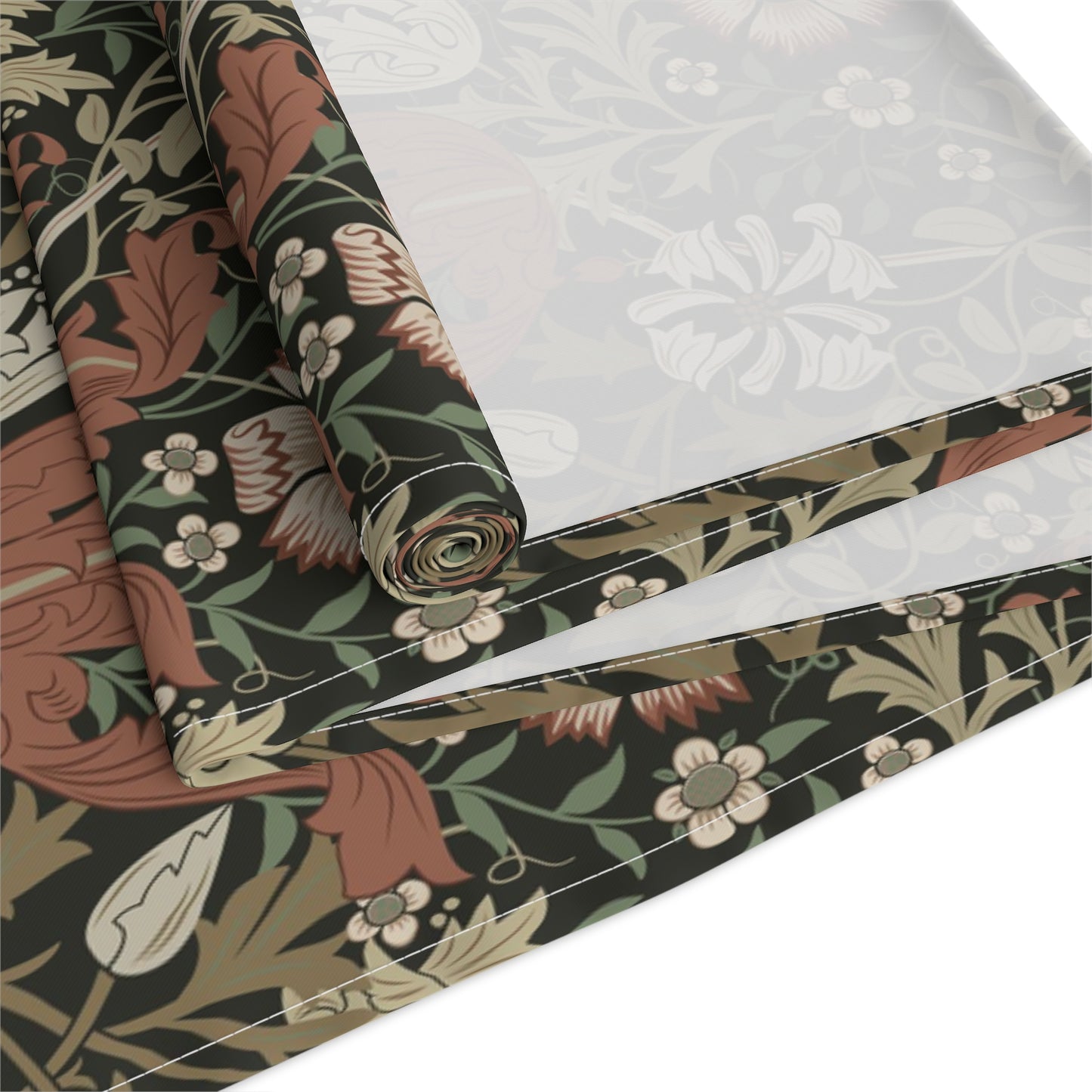A floral patterned table runner inspired by William Morris, displayed on a dining table.