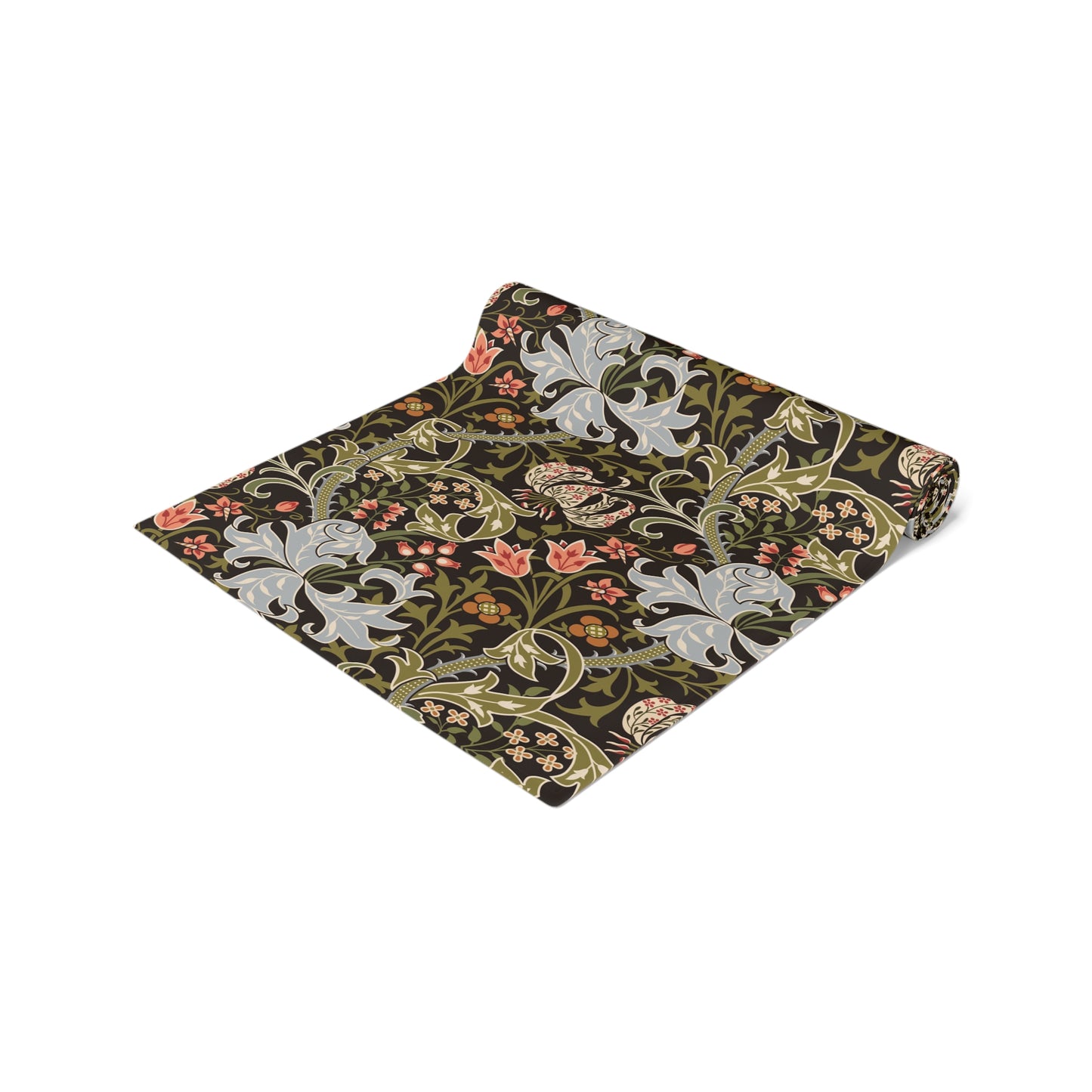 A table runner with a floral William Morris & Co pattern in shades of green, gold, and other colours, laid out on a dining table with dishes and glasses arranged on top.