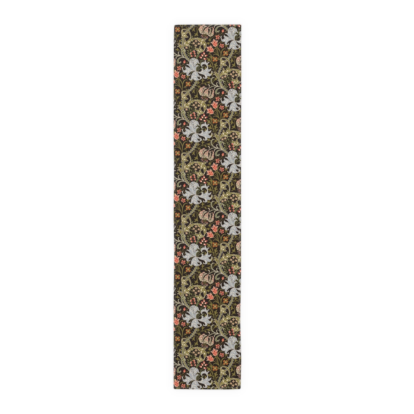 A table runner with a floral William Morris & Co pattern in shades of green, gold, and other colours, laid out on a dining table with dishes and glasses arranged on top.