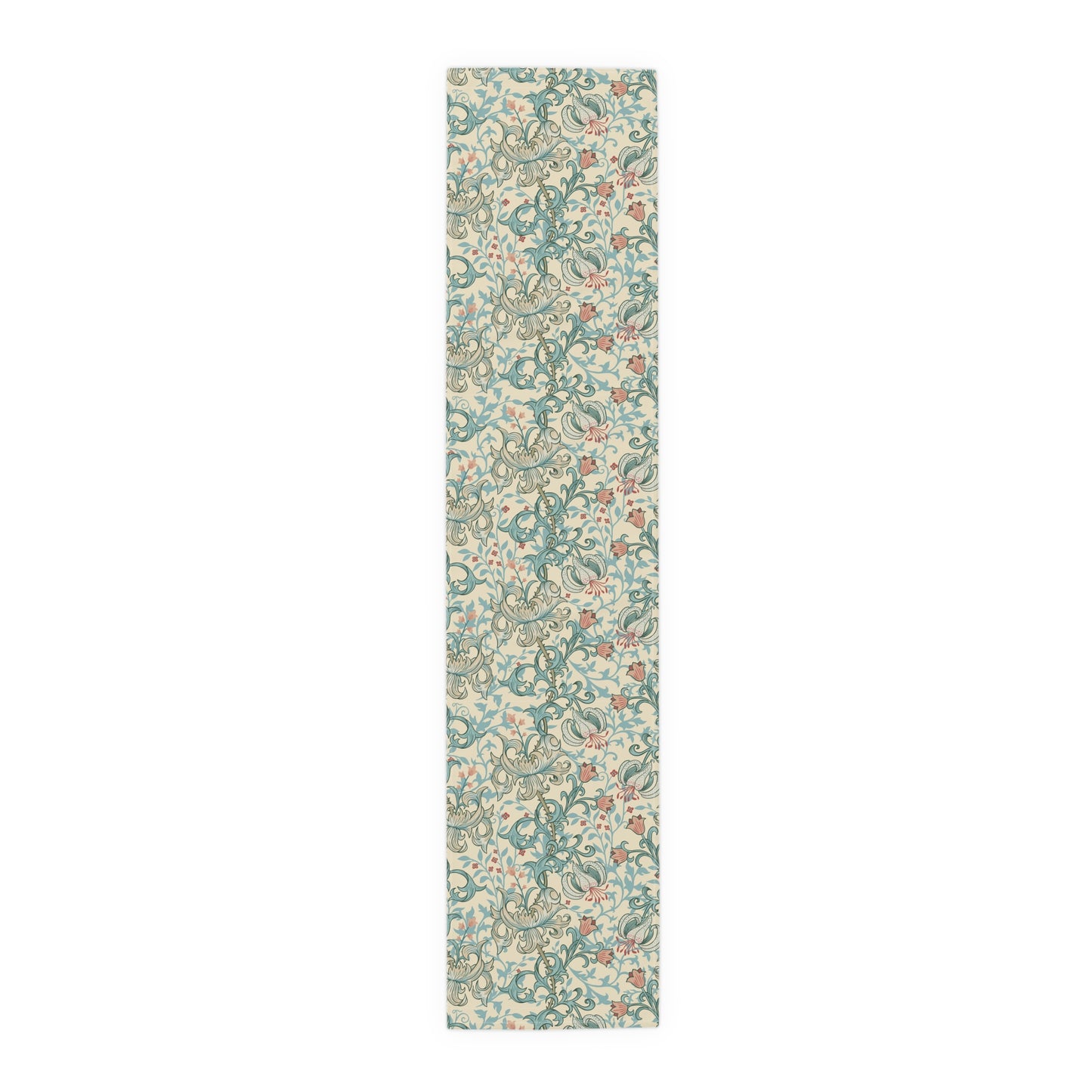 A table runner with a floral William Morris & Co pattern in green, beige, and gold colours, laid out on a dining table.