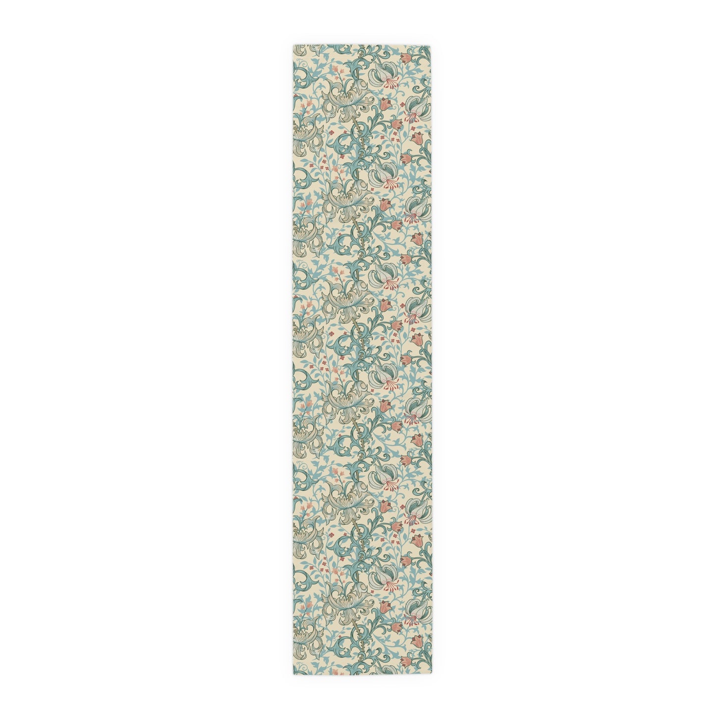 A table runner with a floral William Morris & Co pattern in green, beige, and gold colours, laid out on a dining table.
