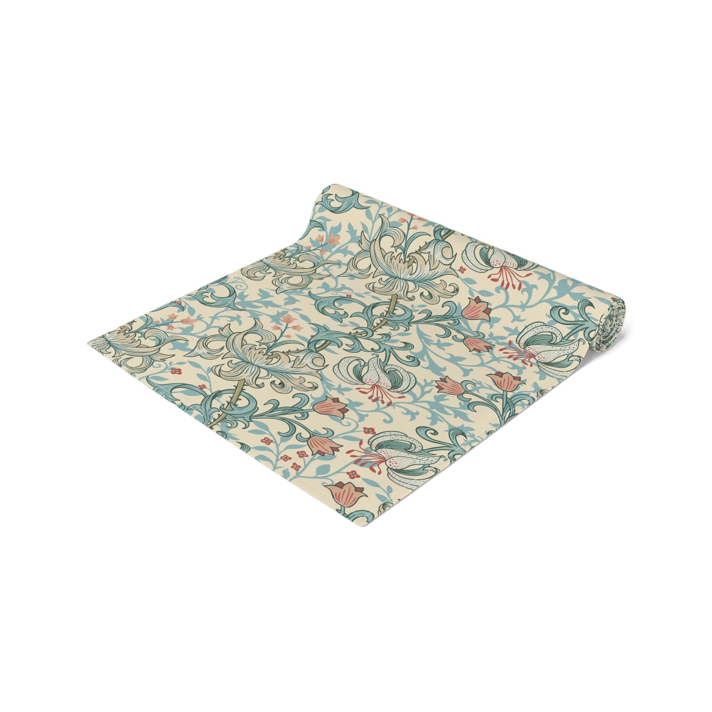 A table runner with a floral William Morris & Co pattern in green, beige, and gold colours, laid out on a dining table.