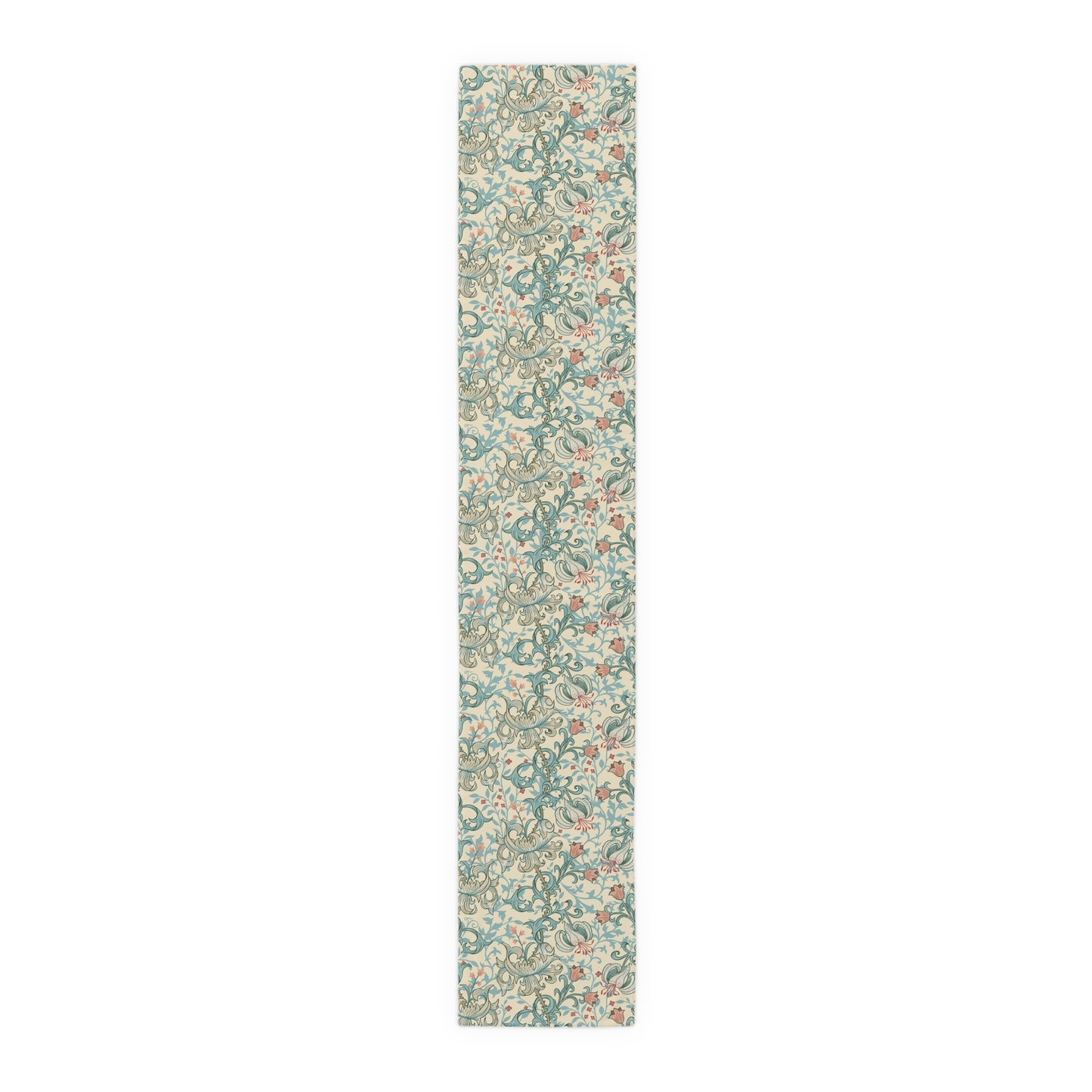 A table runner with a floral William Morris & Co pattern in green, beige, and gold colours, laid out on a dining table.