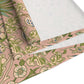 A floral patterned table runner inspired by William Morris' work, displayed on a dining table.