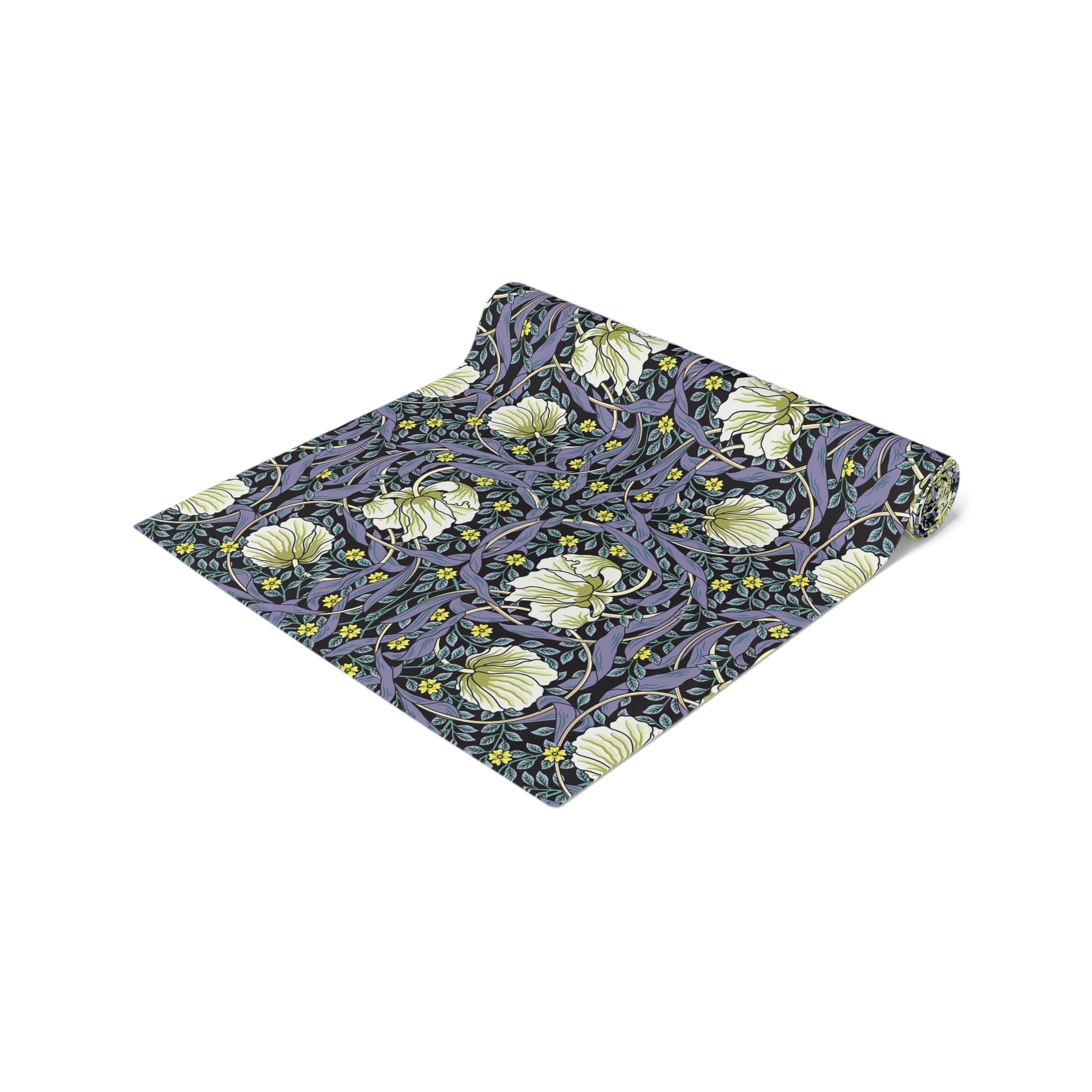 A table runner with a floral William Morris & Co pattern in shades of purple and green laid out on a dining table.
