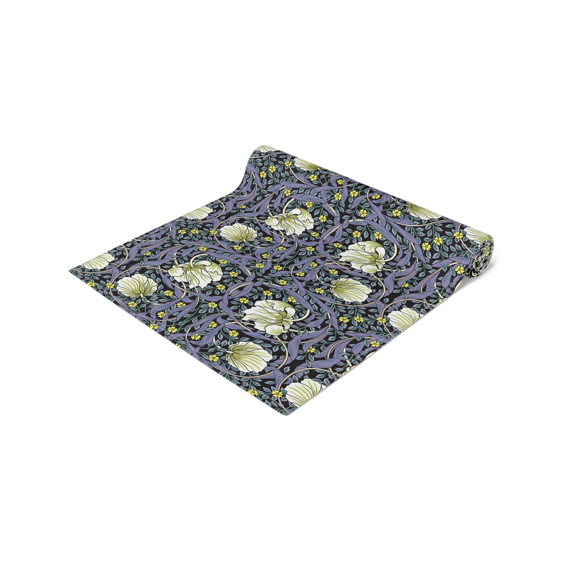A table runner with a floral William Morris & Co pattern in shades of purple and green laid out on a dining table.