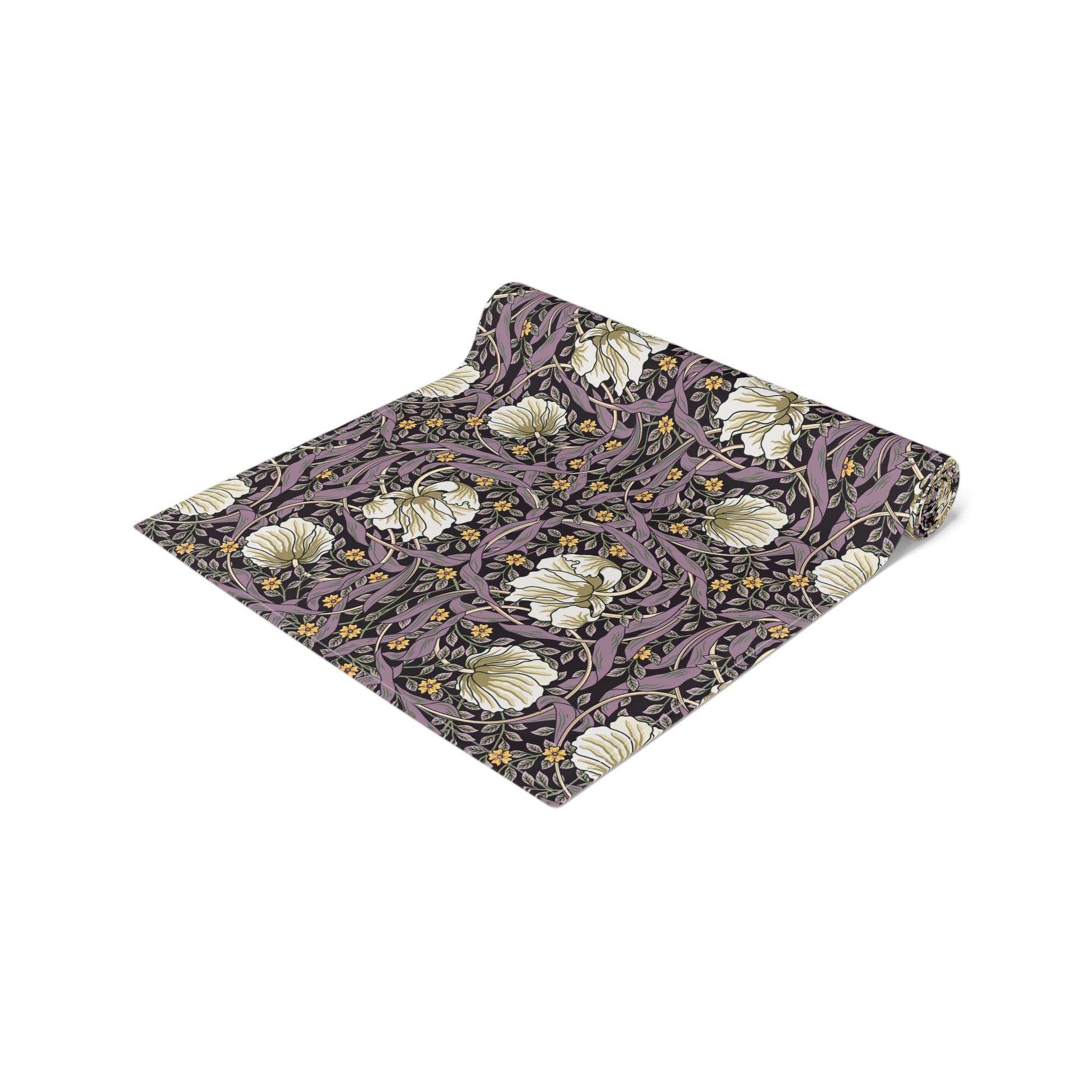 A table runner with a floral William Morris & Co pattern in purple, gold, and green colours, laid out on a dining table.