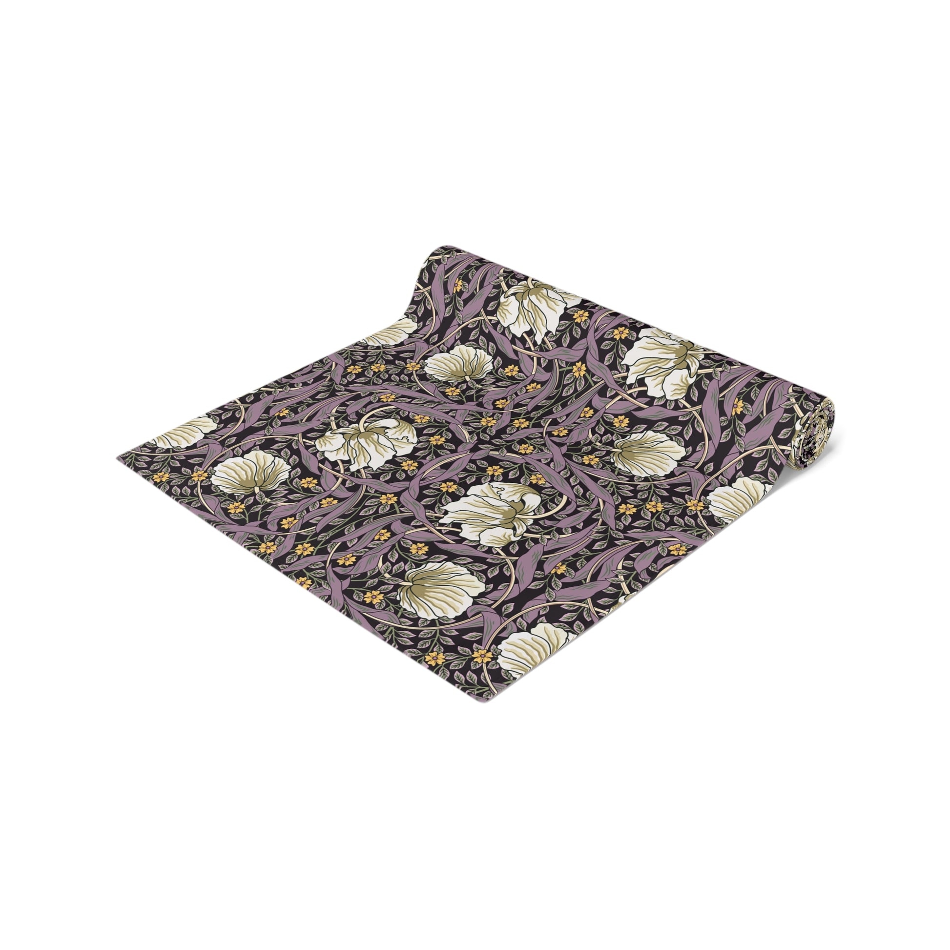 A table runner with a floral William Morris & Co pattern in purple, gold, and green colours, laid out on a dining table.