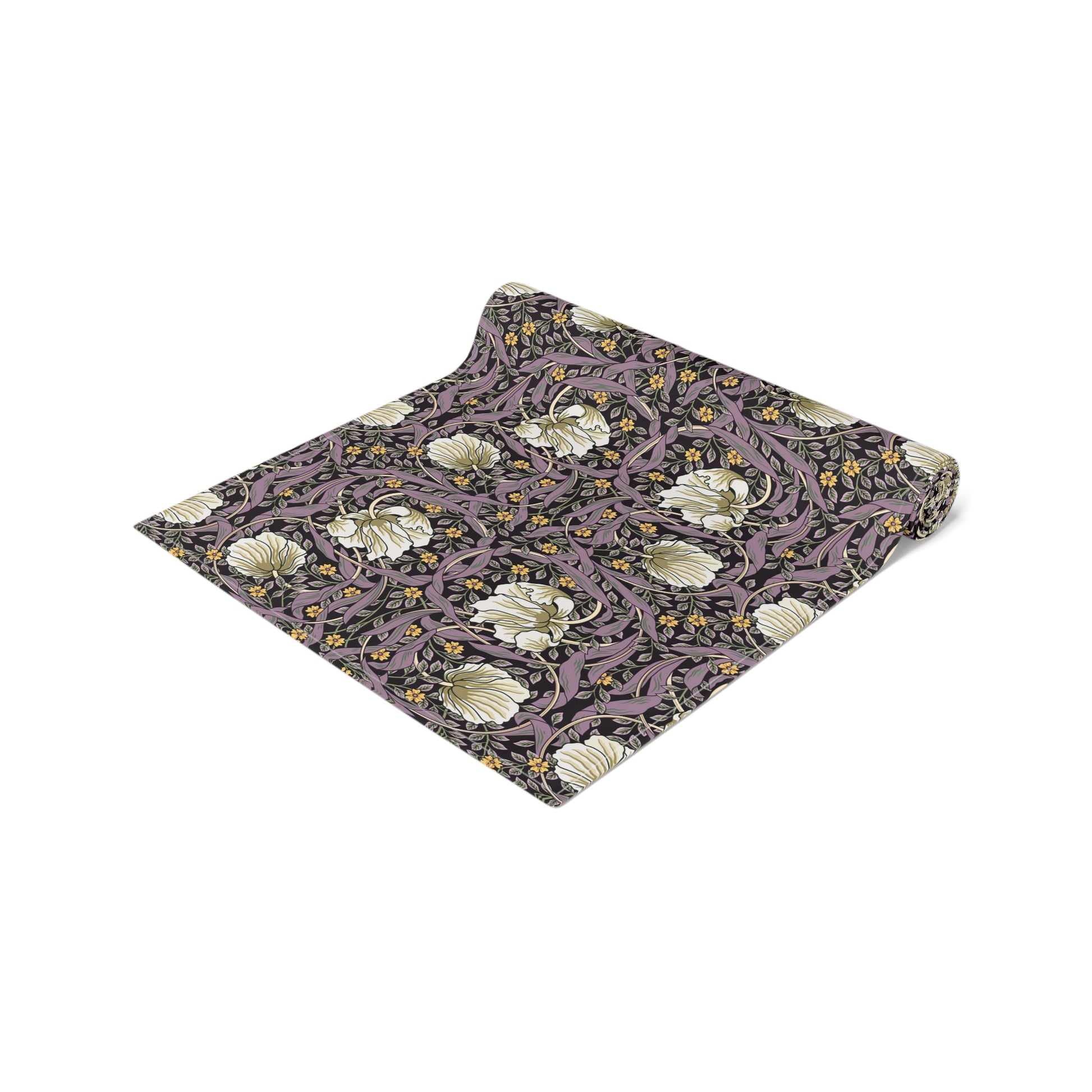 A table runner with a floral William Morris & Co pattern in purple, gold, and green colours, laid out on a dining table.
