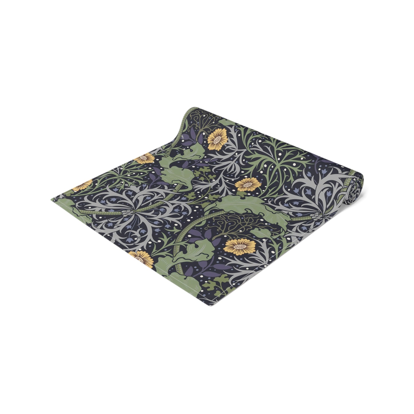 A table runner with a floral William Morris & Co pattern in yellow and green shades displayed on a dining table.