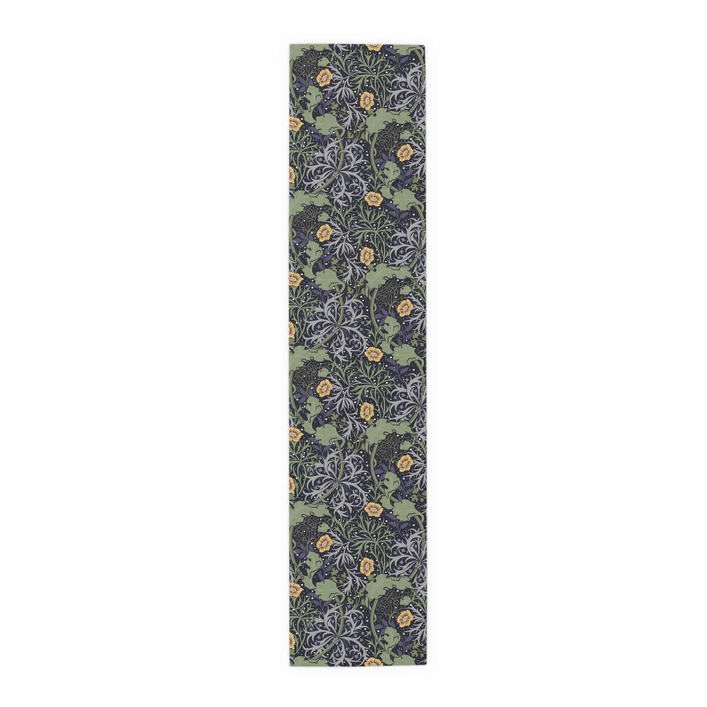 A table runner with a floral William Morris & Co pattern in yellow and green shades displayed on a dining table.