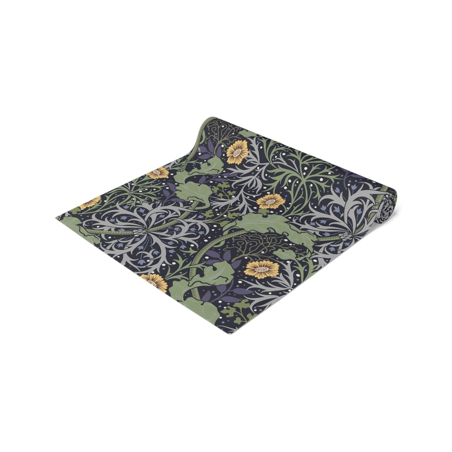 A table runner with a floral William Morris & Co pattern in yellow and green shades displayed on a dining table.