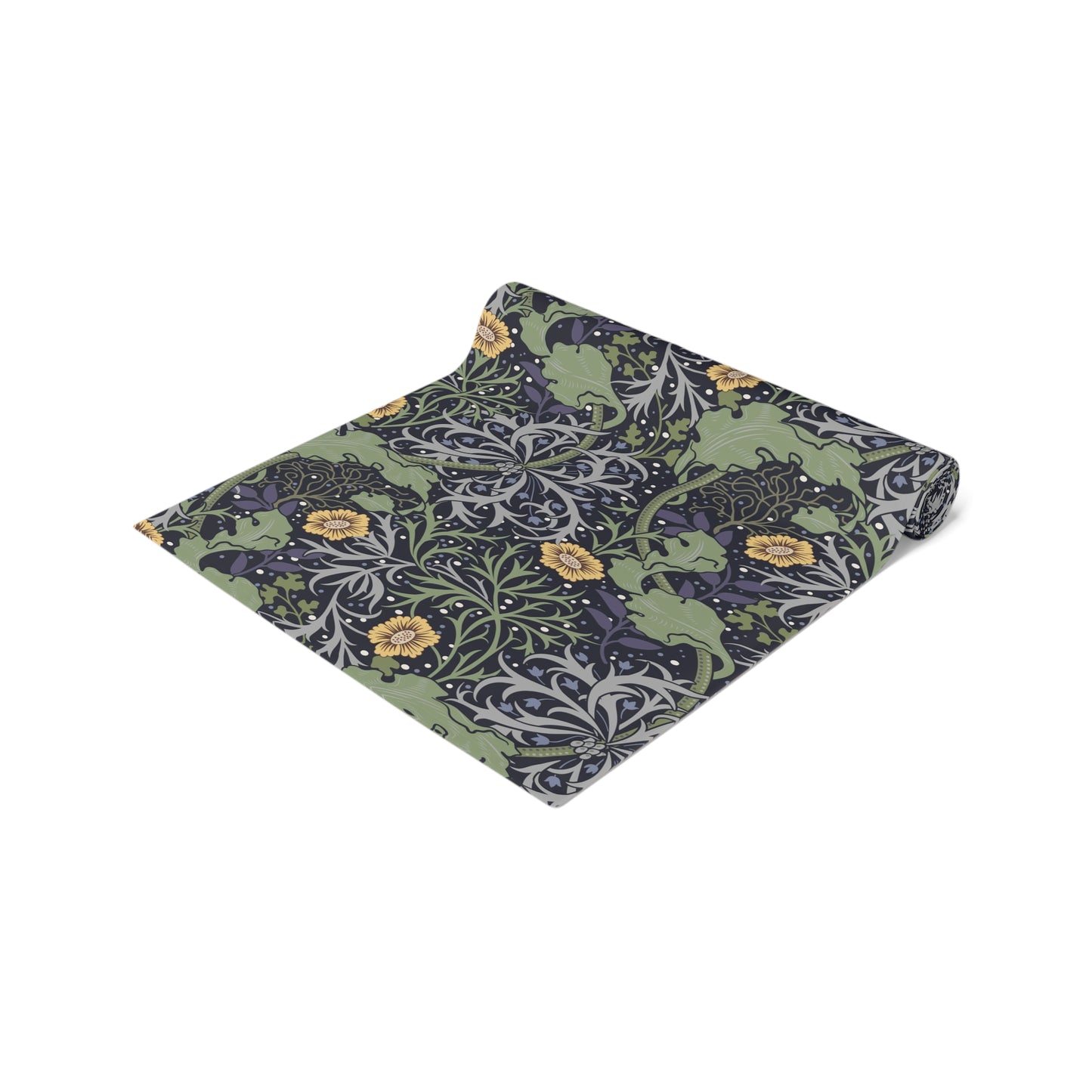 A table runner with a floral William Morris & Co pattern in yellow and green shades displayed on a dining table.
