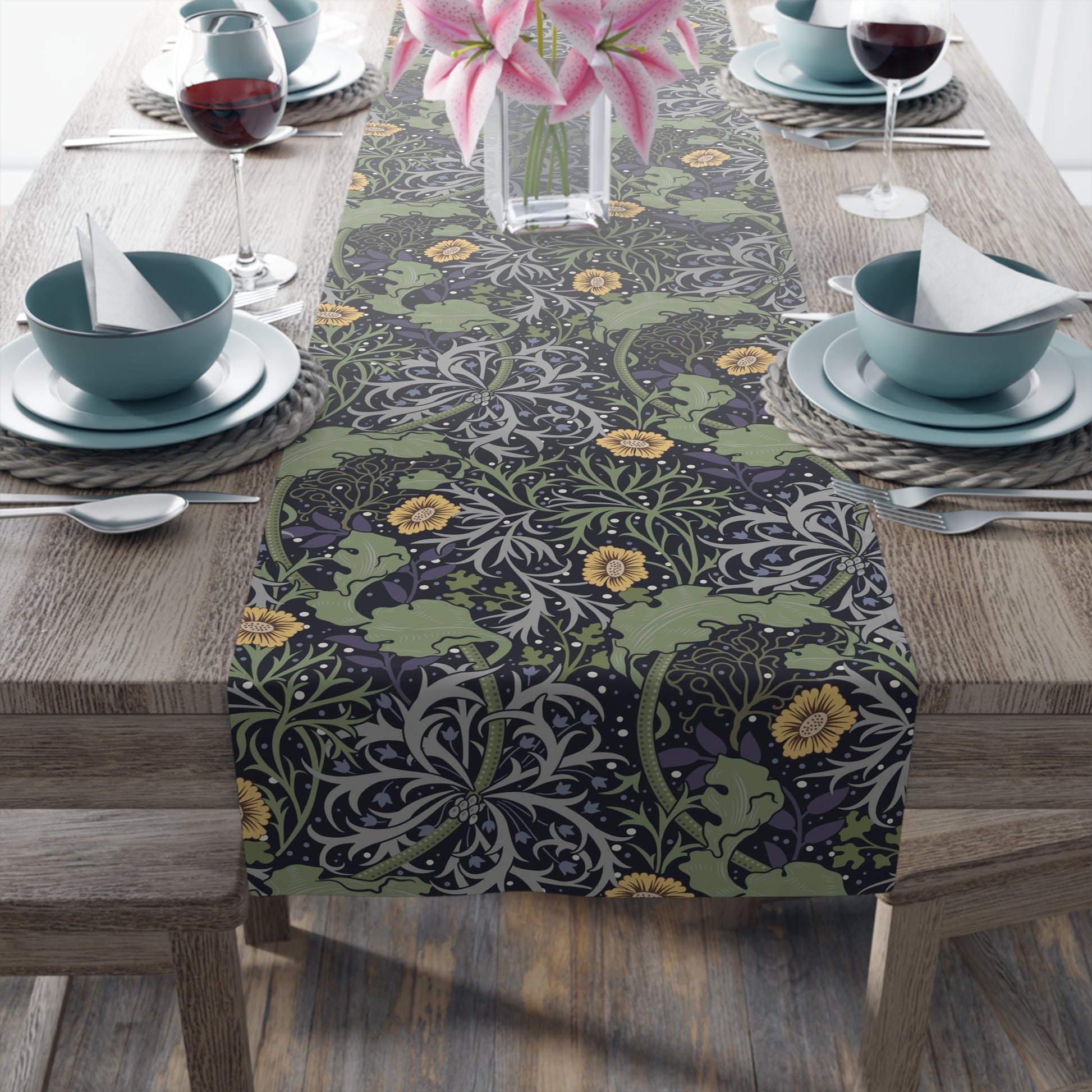 A table runner with a floral pattern in yellow and green shades displayed on a dining table.