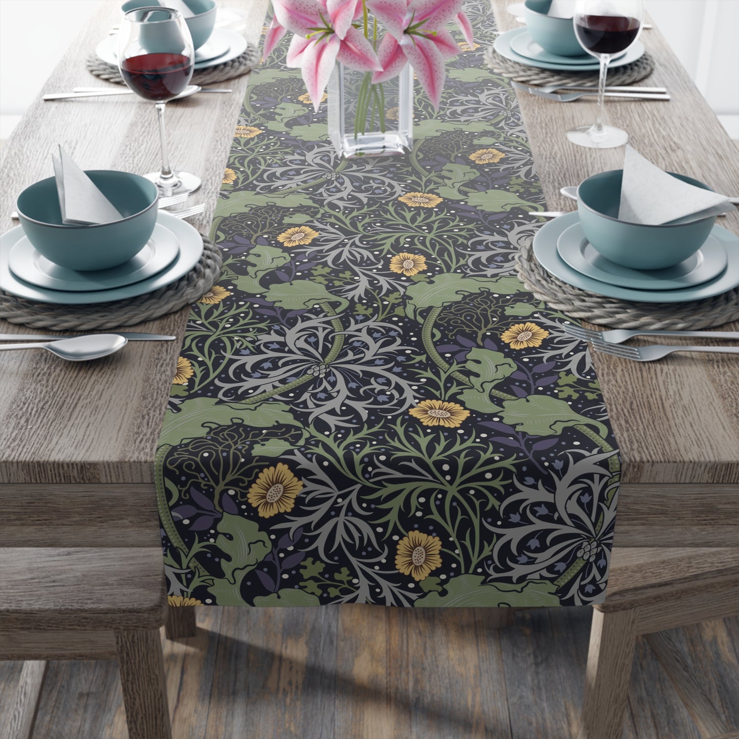 A table runner with a floral pattern in yellow and green shades displayed on a dining table.