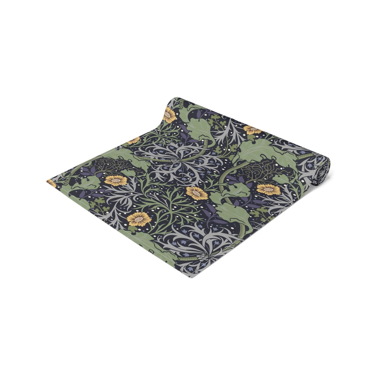 A table runner with a floral William Morris & Co pattern in yellow and green shades displayed on a dining table.