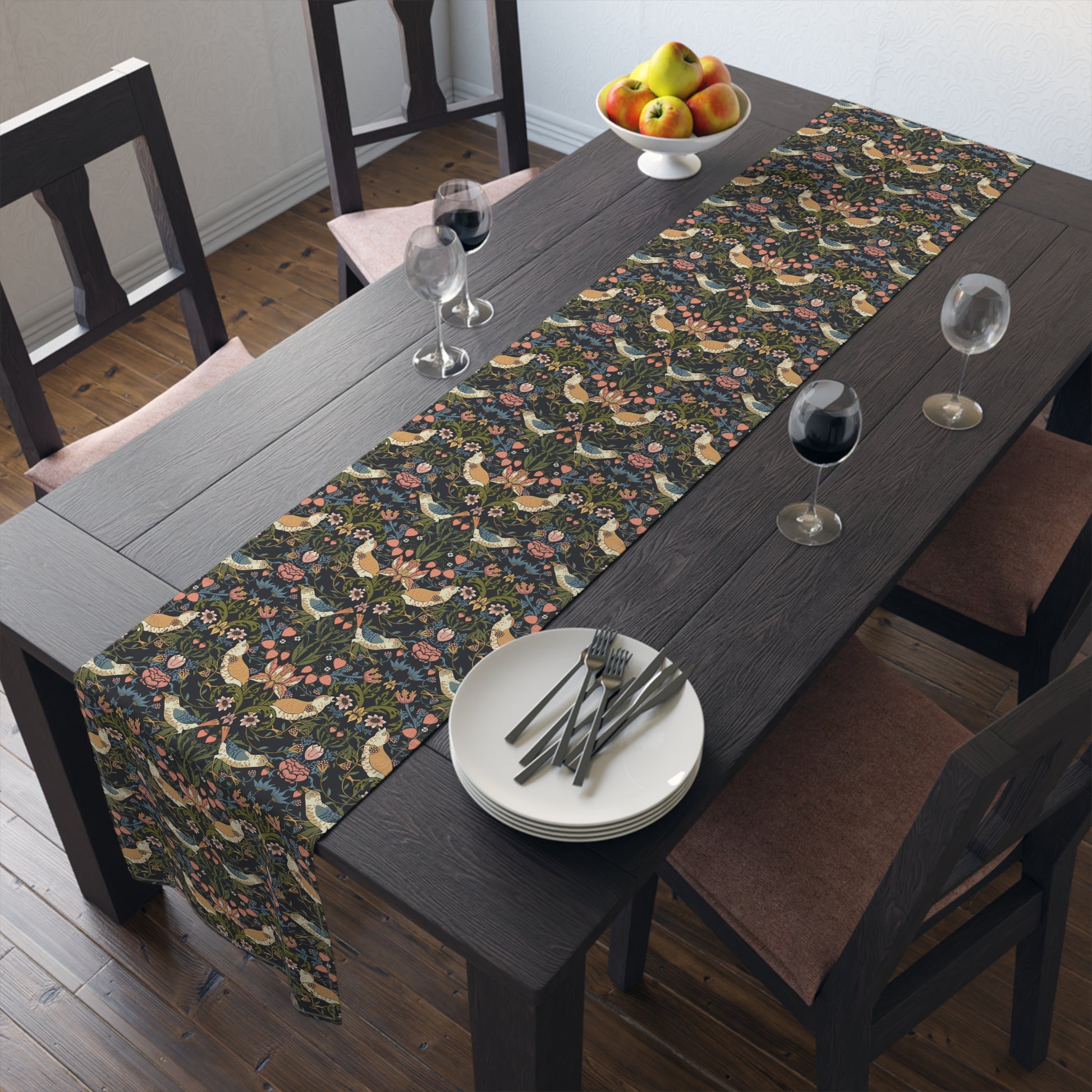 Dining table with floral table runner and fruit bowl.