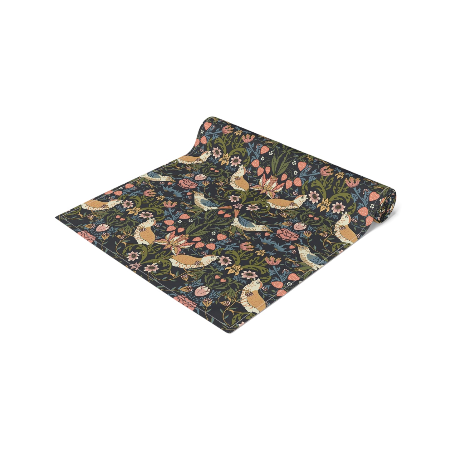 Floral patterned blanket with birds and flowers on a dark background.