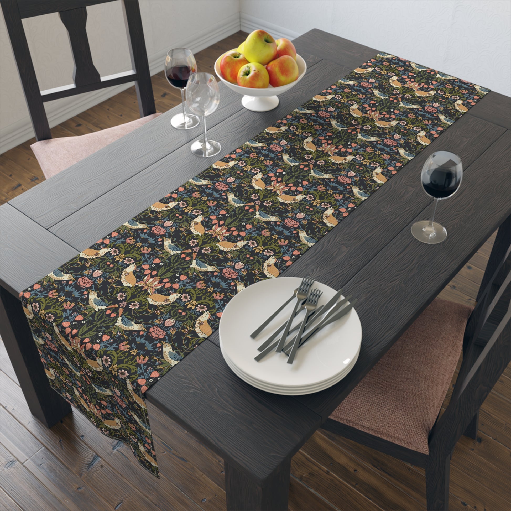 Dining table with floral table runner and place settings.