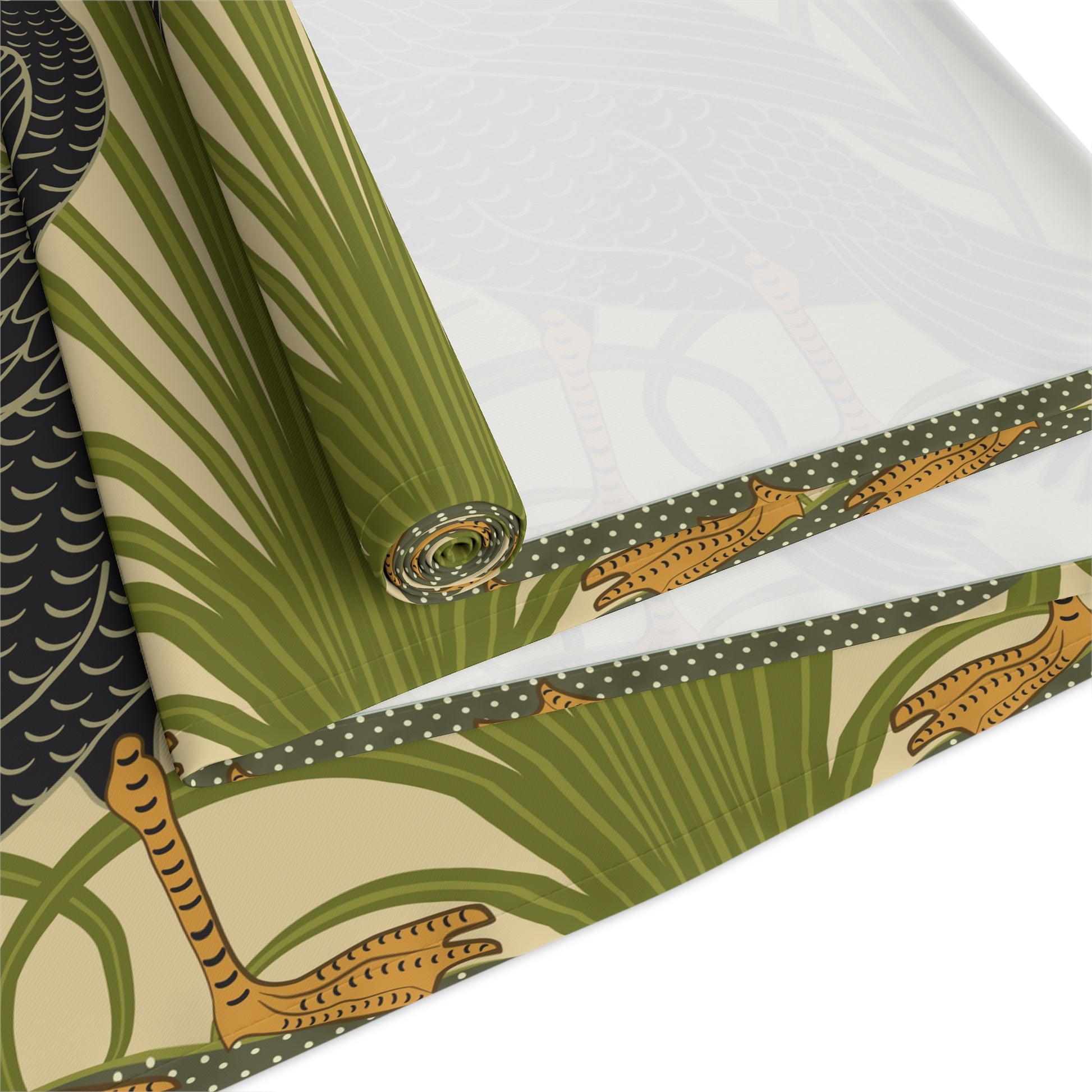 Table setting with a decorative table runner inspired by William Morris & Co featuring black swans on a tan coloured background.