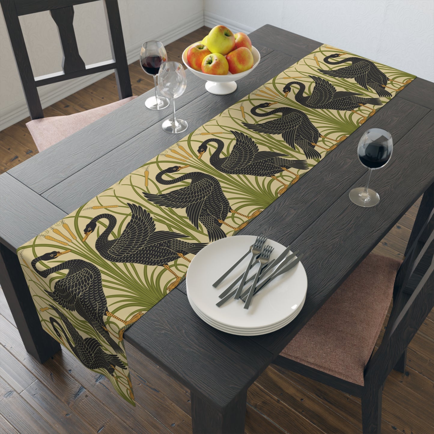 Table setting with a decorative table runner inspired by William Morris & Co featuring black swans on a tan coloured background.