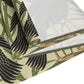 Table setting with a decorative table runner inspired by William Morris & Co featuring black swans on a tan coloured background.