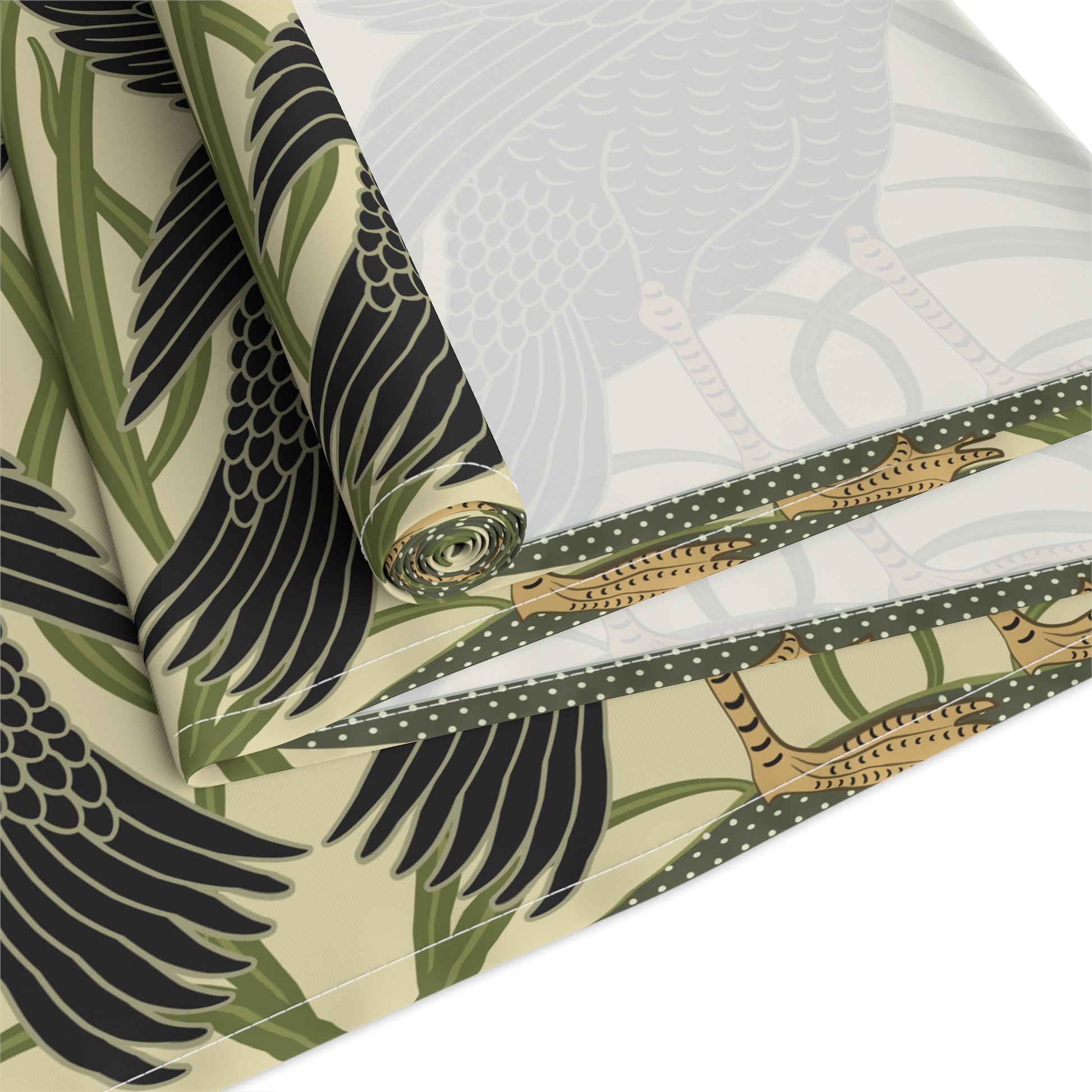 Table setting with a decorative table runner inspired by William Morris & Co featuring black swans on a tan coloured background.