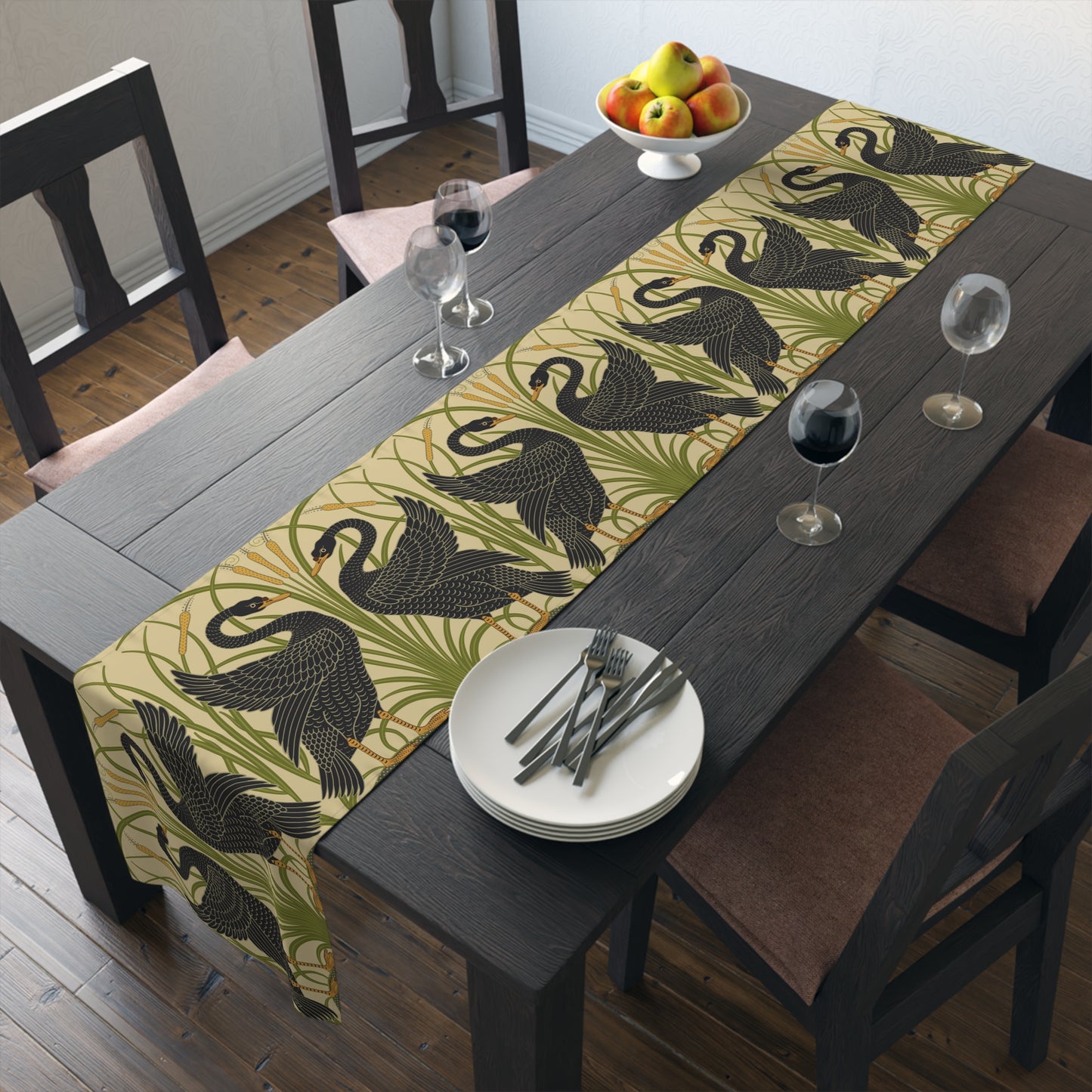 Table setting with a decorative table runner inspired by William Morris & Co featuring black swans on a tan coloured background.