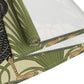 Table setting with a decorative table runner inspired by William Morris & Co featuring black swans on a tan coloured background.
