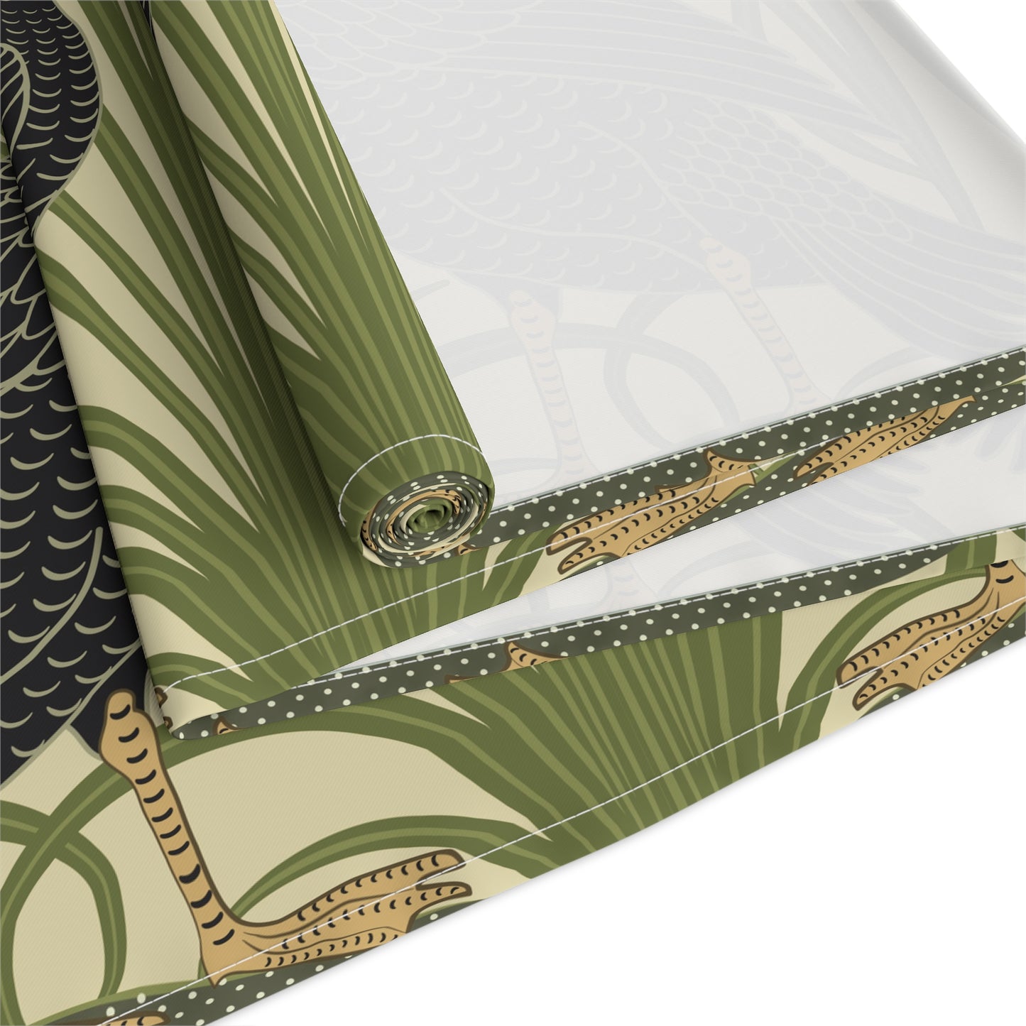 Table setting with a decorative table runner inspired by William Morris & Co featuring black swans on a tan coloured background.