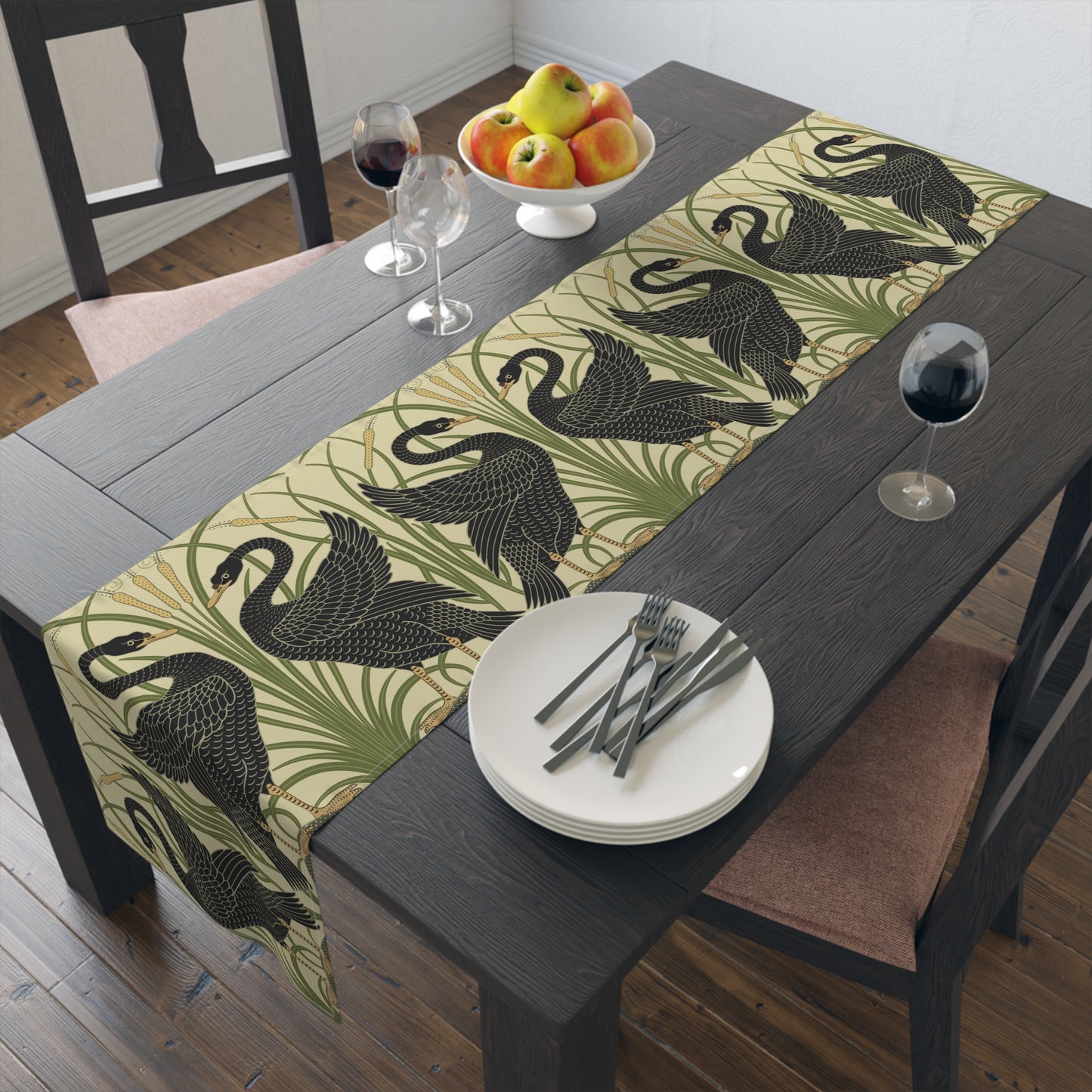 Table setting with a decorative table runner inspired by William Morris & Co featuring black swans on a tan coloured background.