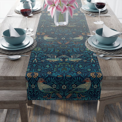 A William Morris & Co table runner with a bluebird design laid out on a dining table, featuring a repeating pattern with birds and foliage.
