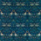 A William Morris & Co table runner with a bluebird design laid out on a dining table, featuring a repeating pattern with birds and foliage.