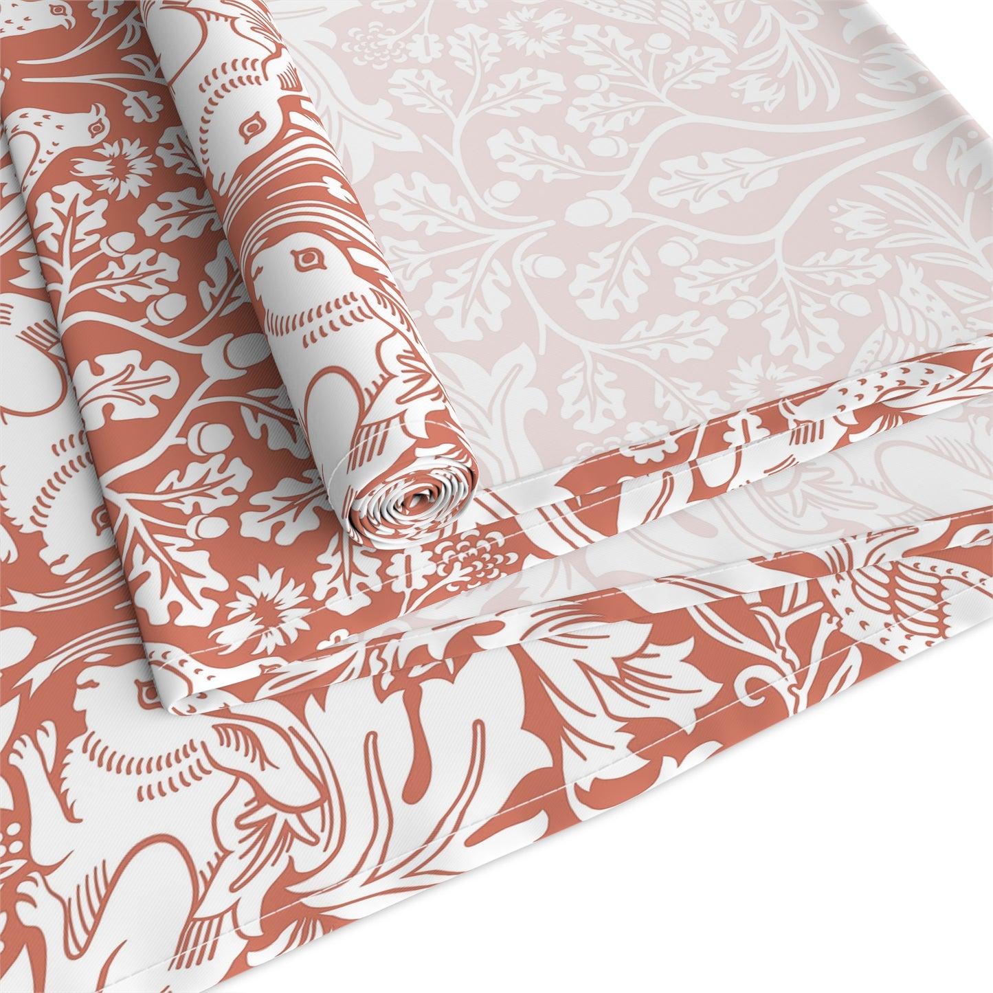 Roll of fabric with a floral pattern on a white background