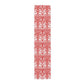 Red and white patterned table runner on a white background