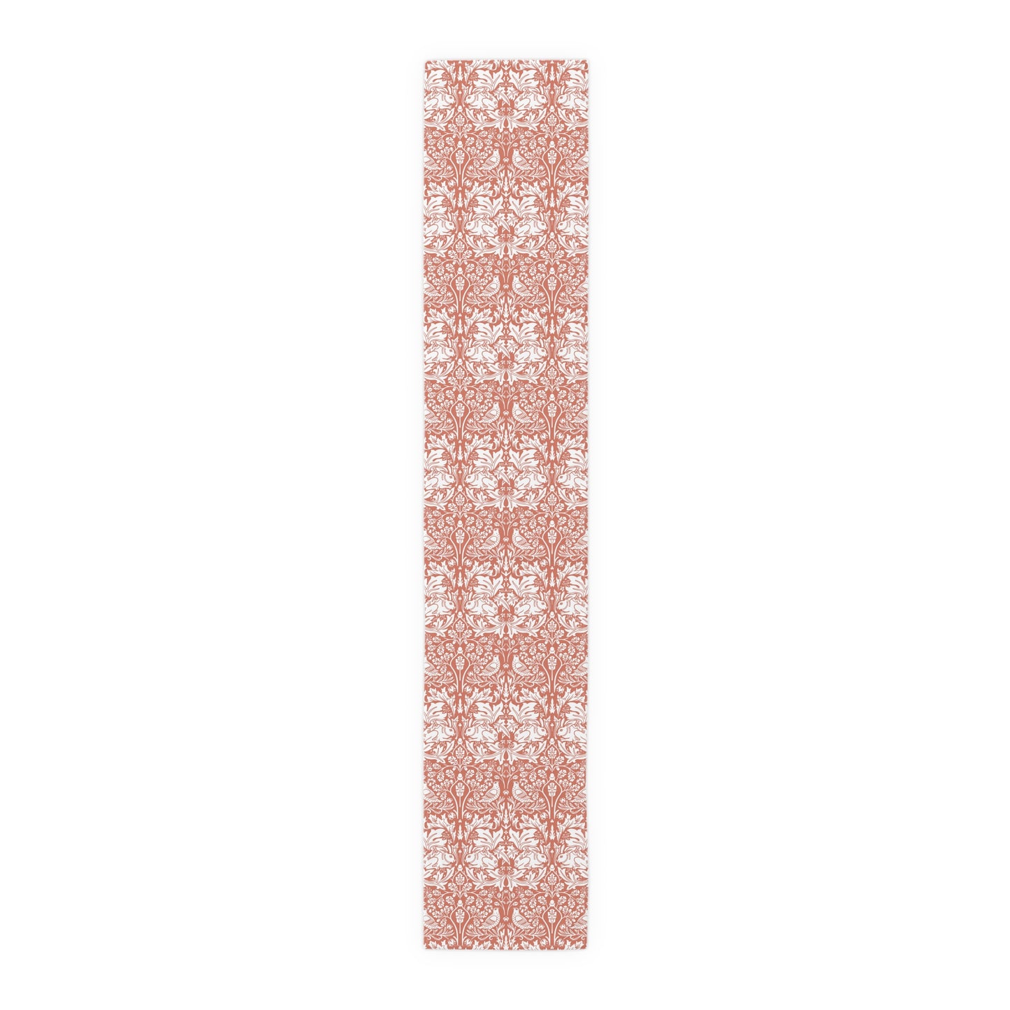 Long, narrow decorative mat with a floral pattern on a white background
