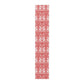 Red and white patterned table runner on a white background