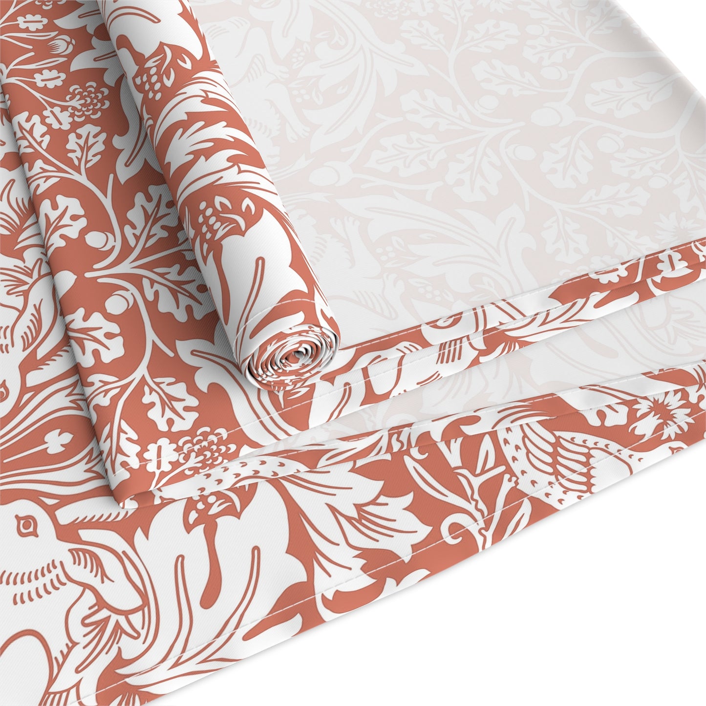 Roll of fabric with a floral pattern on a white background