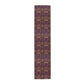 A multicolored table runner with a floral and William Morris & Co animal pattern displayed on a dining table.