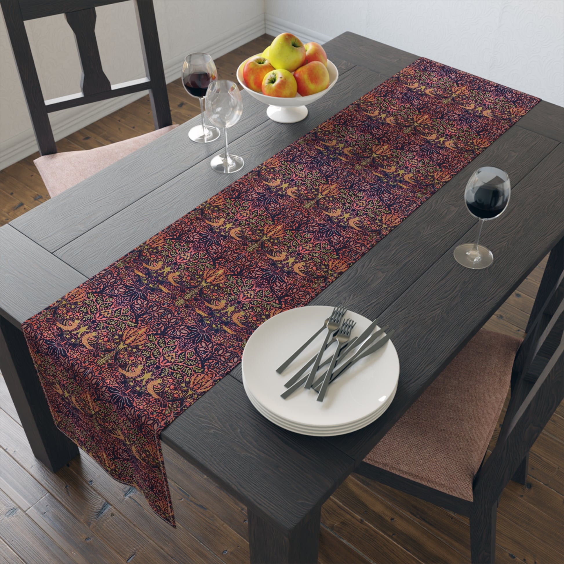 A multicolored table runner with a floral and William Morris & Co animal pattern displayed on a dining table.