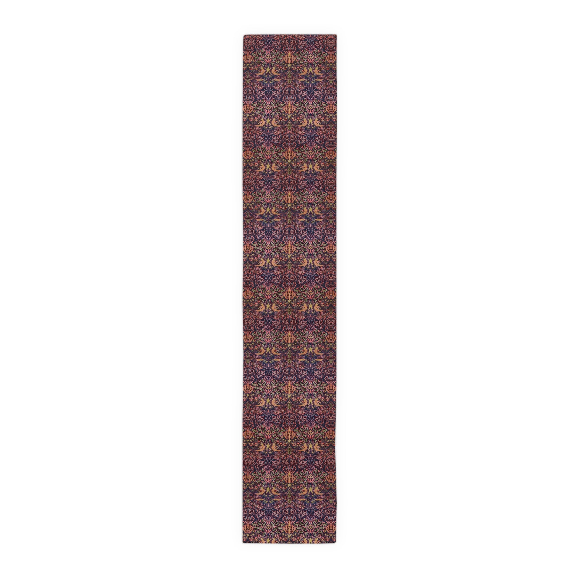 A multicolored table runner with a floral and William Morris & Co animal pattern displayed on a dining table.