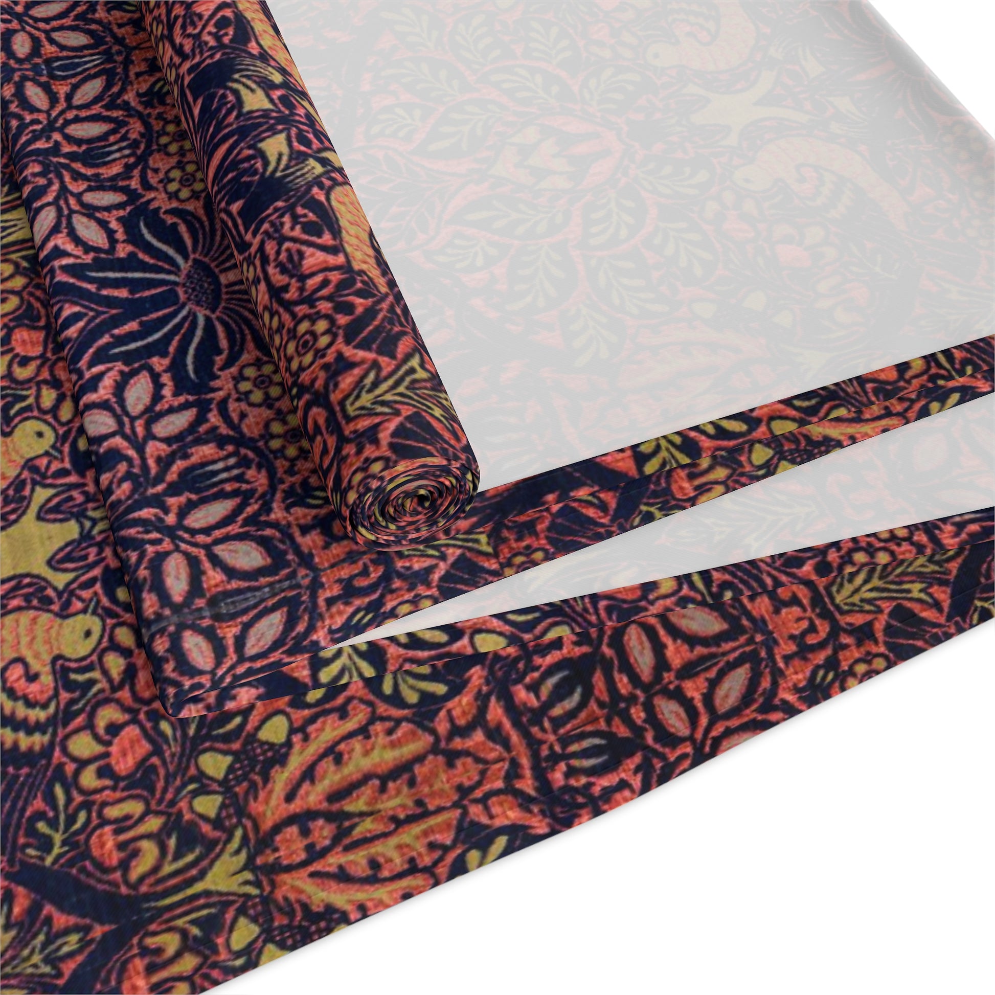 A multicolored table runner with a floral and William Morris & Co animal pattern displayed on a dining table.