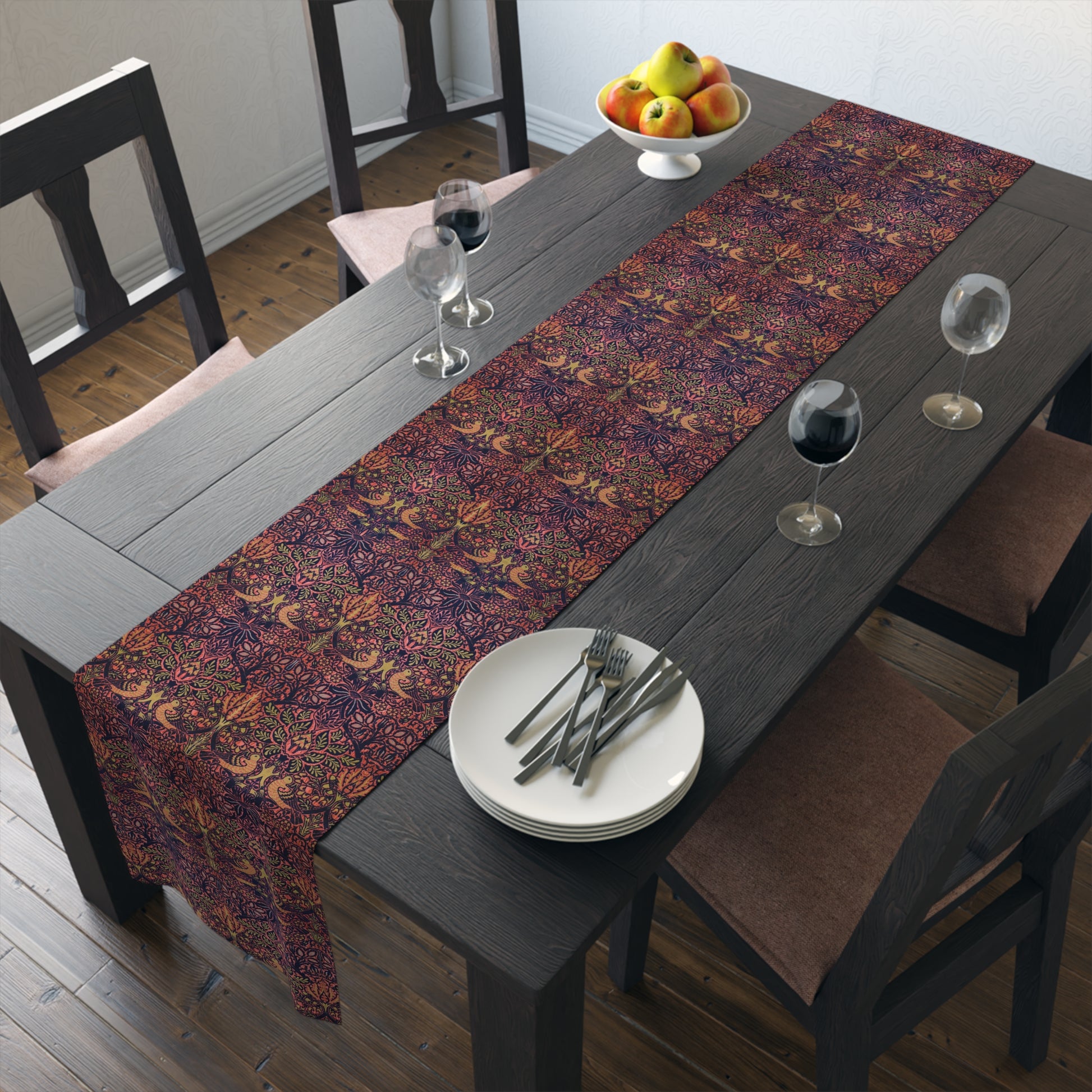 A multicolored table runner with a floral and William Morris & Co animal pattern displayed on a dining table.