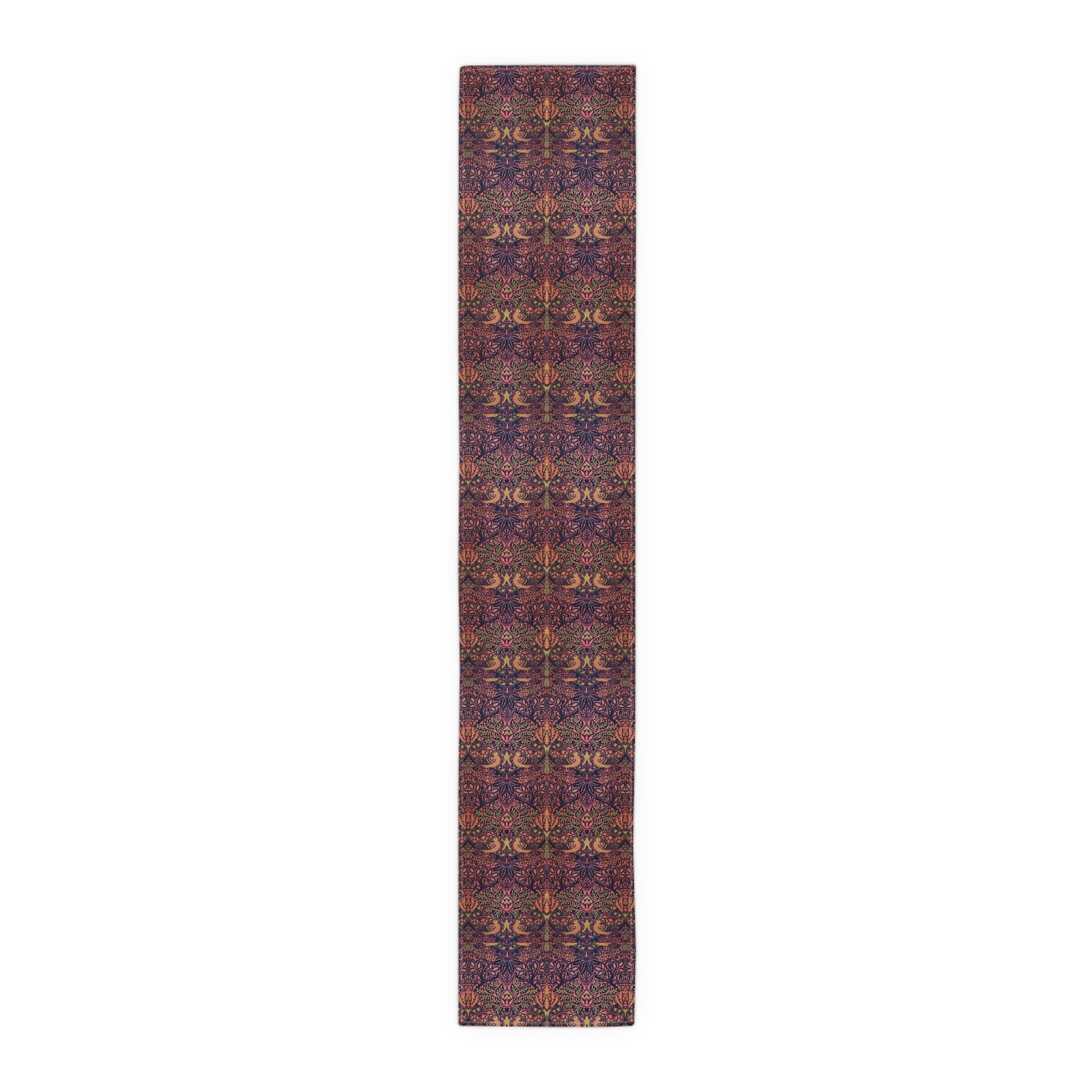 A multicolored table runner with a floral and William Morris & Co animal pattern displayed on a dining table.
