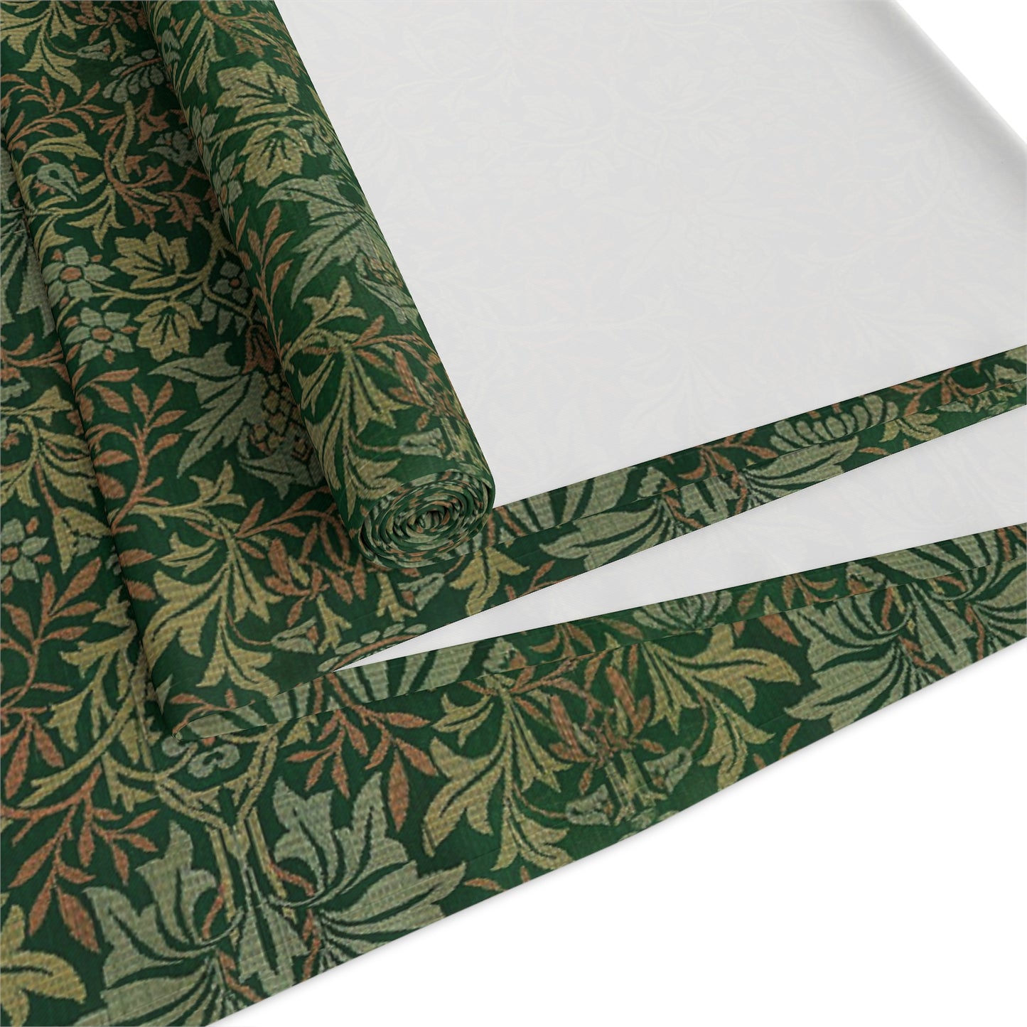 A green table runner with a floral William Morris & Co pattern displayed on a dining table.