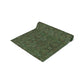 A green table runner with a floral William Morris & Co pattern displayed on a dining table.
