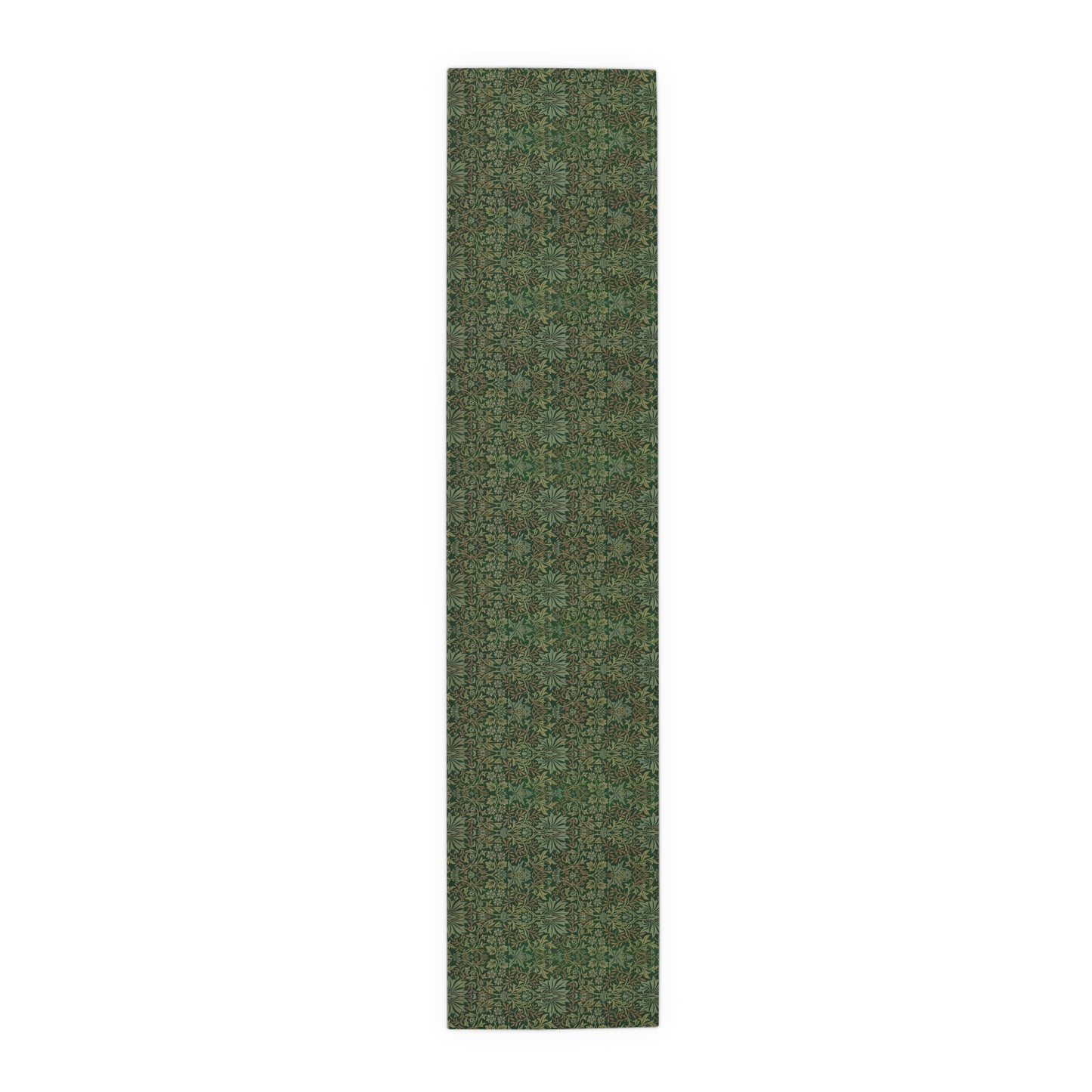 A green table runner with a floral William Morris & Co pattern displayed on a dining table.