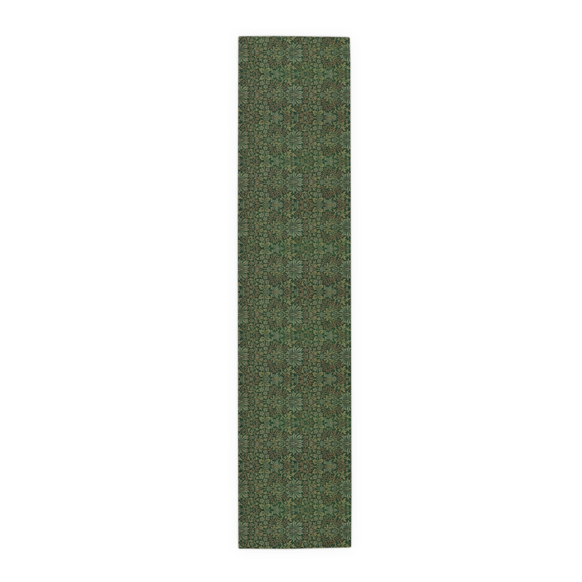 A green table runner with a floral William Morris & Co pattern displayed on a dining table.